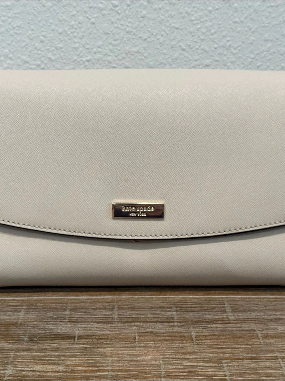 Kate Spade Cream Leather Clutch with Gold Plaque